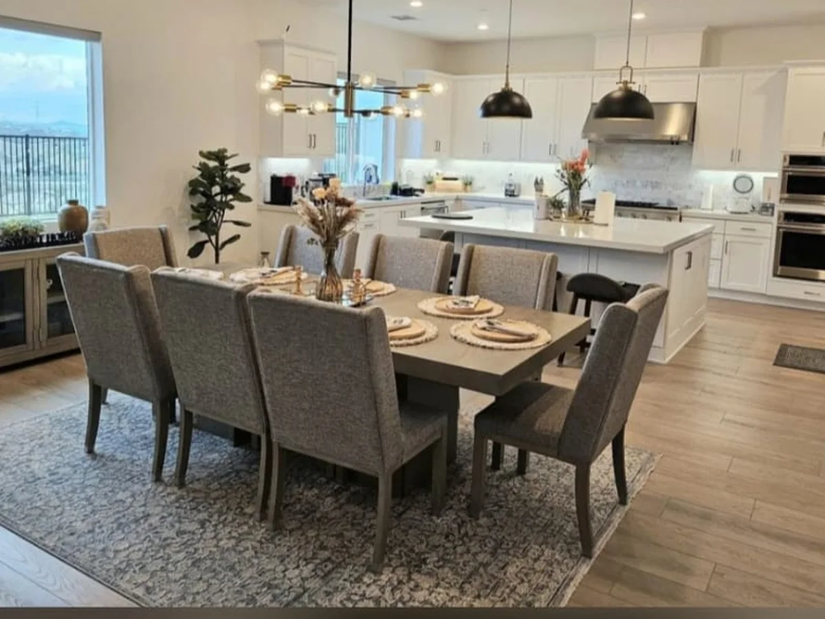Staged dining room and kitchen, spotless